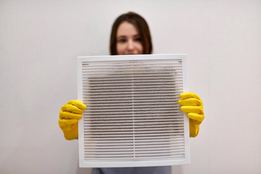 Lady Holding Dirty Vent for Prescription Duct Cleaning Lady Holding Dirty Vent for Prescription Duct Cleaning